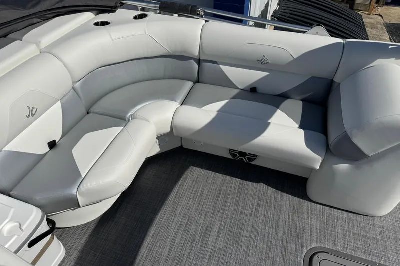 Slide: The Image of Luxurious seating on 2026 JC Spirit 222 TT Sport boat, featuring sleek white upholstery. - 10