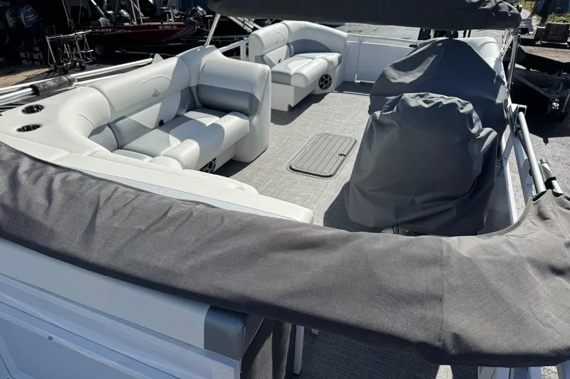 Slide: The Image of 2026 JC Spirit 222 TT Sport pontoon boat with spacious seating and covered helm. - 11