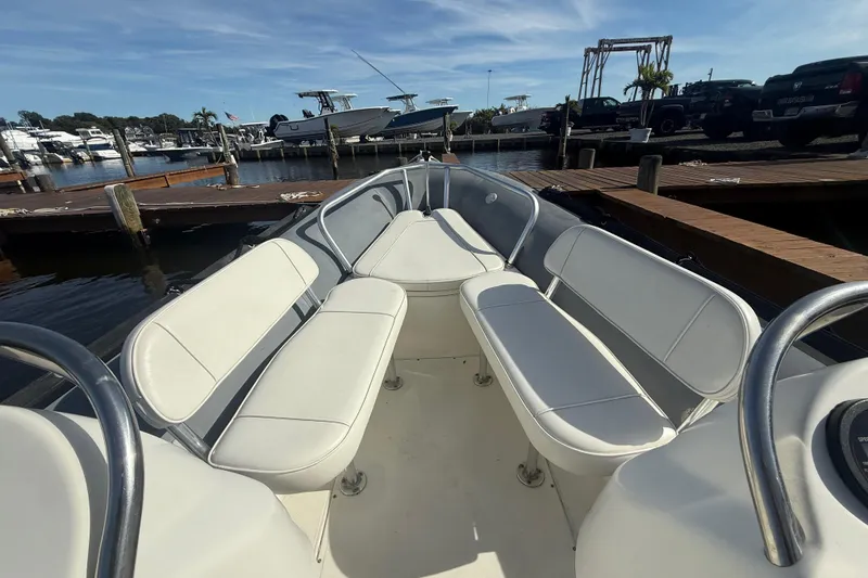 Slide: The Image of 2012 Zodiac Bayrunner Pro 650 boat interior with white seating at marina. - 12