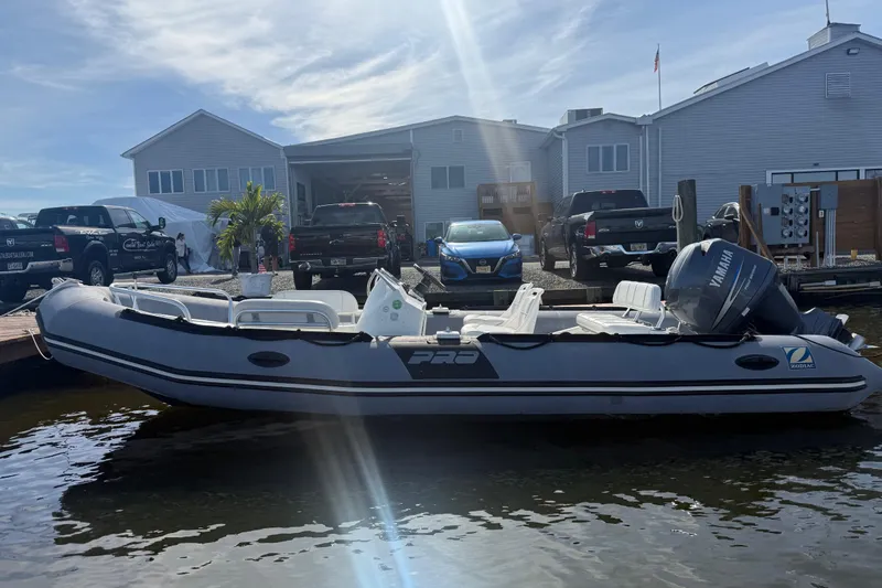 The Image of 2012 Zodiac Bayrunner Pro 650 boat docked near waterfront buildings. - 5
