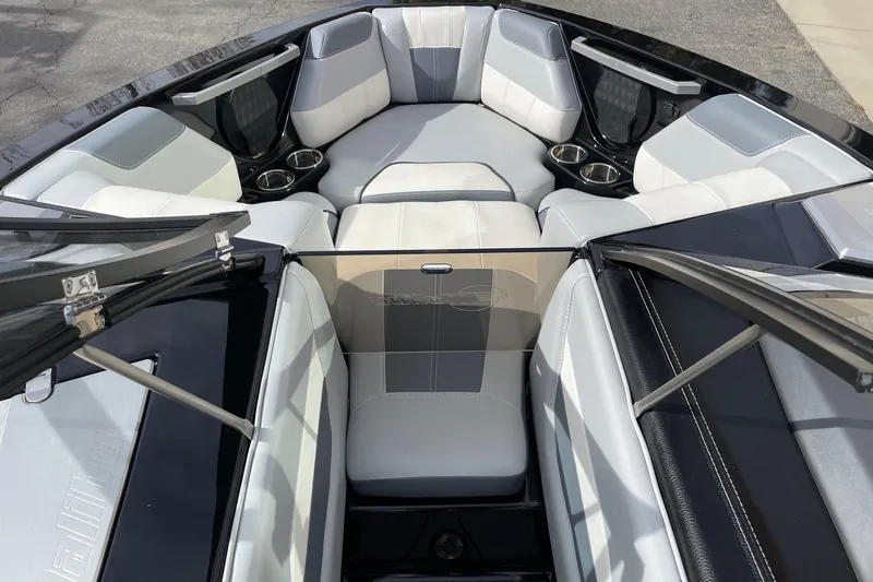 Slide: The Image of 2023 Malibu Wakesetter 20 VTX boat interior with sleek seating and cup holders. - 11