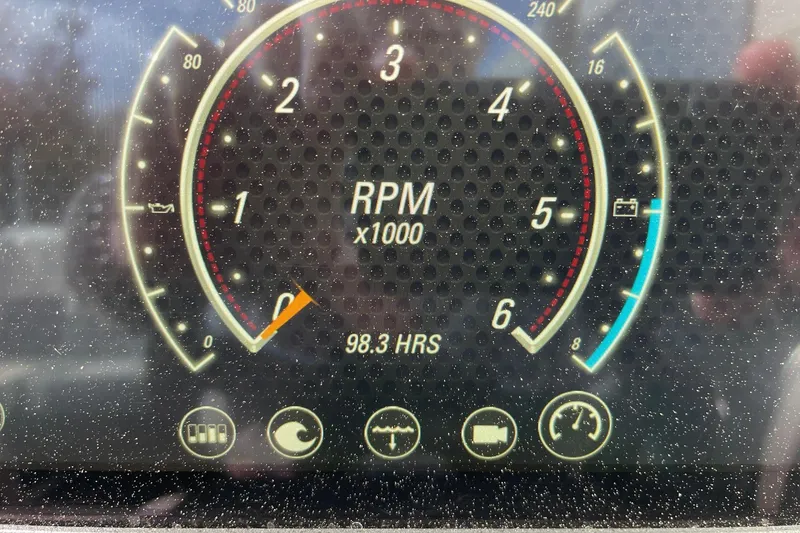 Slide: The Image of 2023 Malibu Wakesetter 20 VTX dashboard showing RPM gauge and 98.3 engine hours. - 13