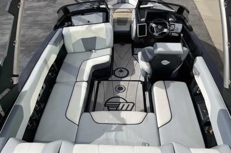 Slide: The Image of 2023 Malibu Wakesetter 20 VTX interior with luxurious seating and modern dashboard design. - 5