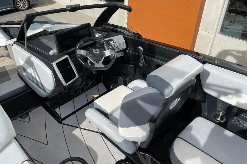 Slide: The Image of 2023 Malibu Wakesetter 20 VTX interior with modern dashboard and seating. - 6