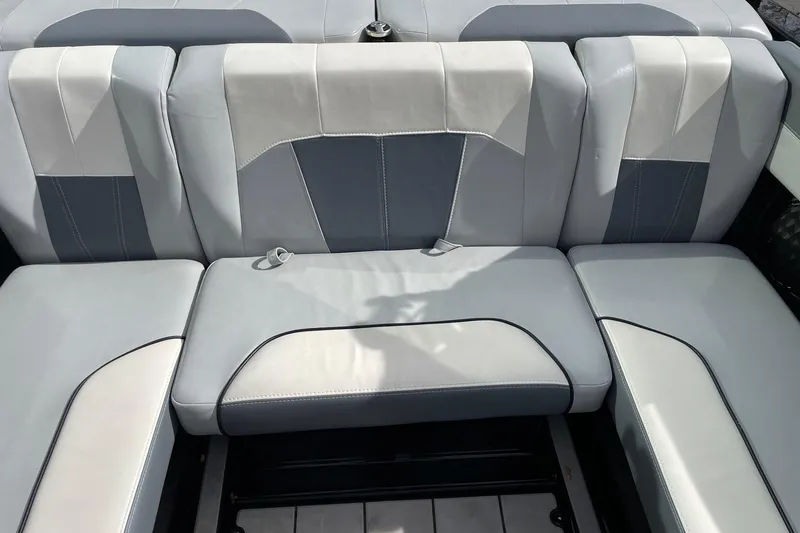 Slide: The Image of 2023 Malibu Wakesetter 20 VTX interior seating, featuring sleek gray and white upholstery. - 8