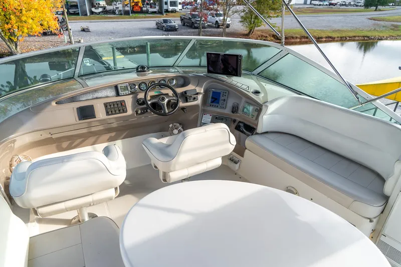 Slide: The Image of Interior view of 2000 Carver 450 Voyager Pilothouse helm with seating and controls. - 20