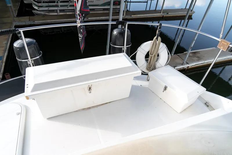 Slide: The Image of 2000 Carver 450 Voyager Pilothouse deck with storage boxes and life preserver. - 29
