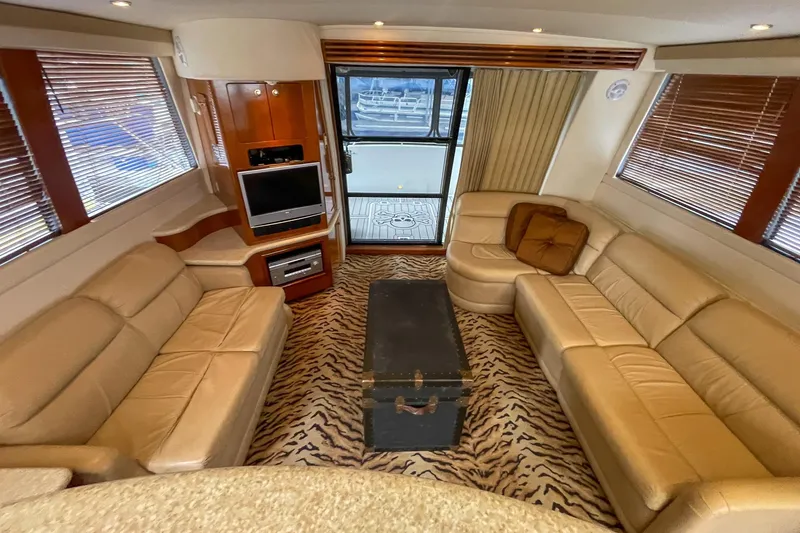 Slide: The Image of Luxurious interior of 2000 Carver 450 Voyager Pilothouse with leather seating and zebra-patterned carpet. - 42