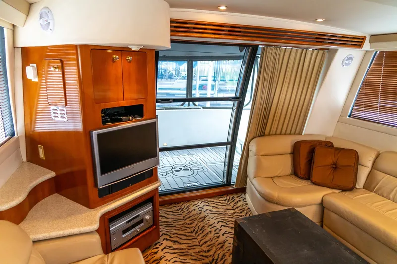Slide: The Image of Luxurious interior of 2000 Carver 450 Voyager Pilothouse with leather seating and entertainment system. - 43