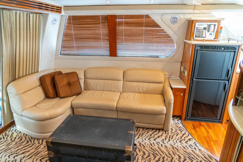 Slide: The Image of Luxurious interior of 2000 Carver 450 Voyager Pilothouse with leather sofa and modern amenities. - 44