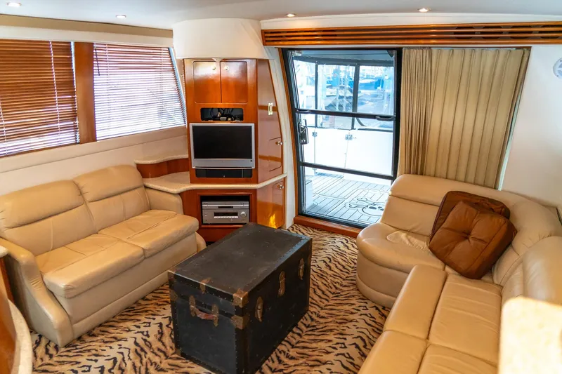 Slide: The Image of Luxurious interior of 2000 Carver 450 Voyager Pilothouse with plush seating and entertainment center. - 45
