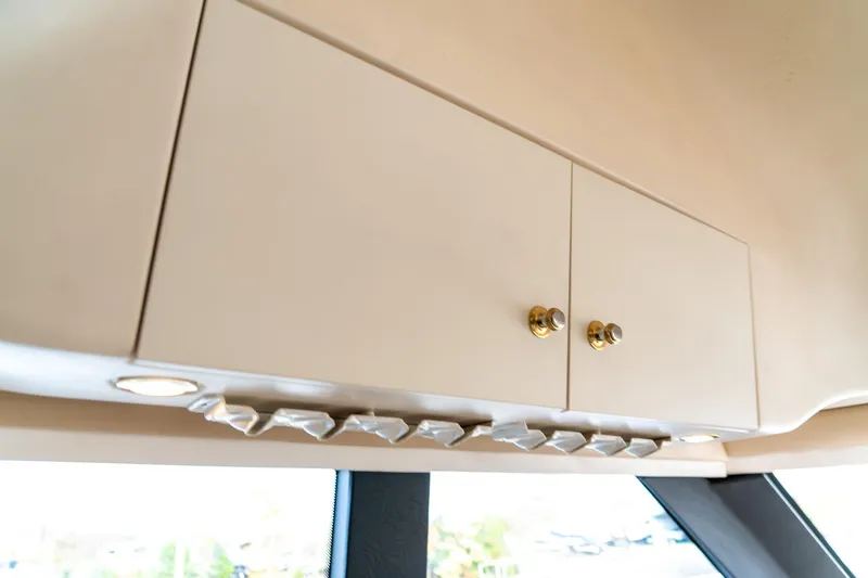 Slide: The Image of Cabinet interior of 2000 Carver 450 Voyager Pilothouse with modern lighting. - 48