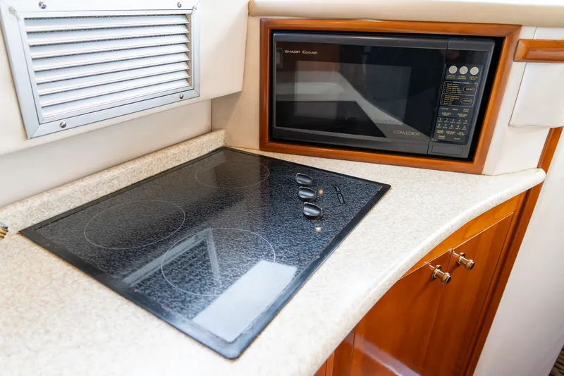 Slide: The Image of Modern kitchen in 2000 Carver 450 Voyager Pilothouse with stovetop and microwave. - 50