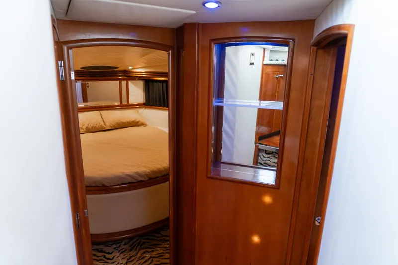 Slide: The Image of Interior of 2000 Carver 450 Voyager Pilothouse with cozy bedroom and wooden accents. - 57