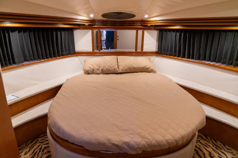 Slide: The Image of Luxurious bedroom in 2000 Carver 450 Voyager Pilothouse yacht with cozy bedding. - 58