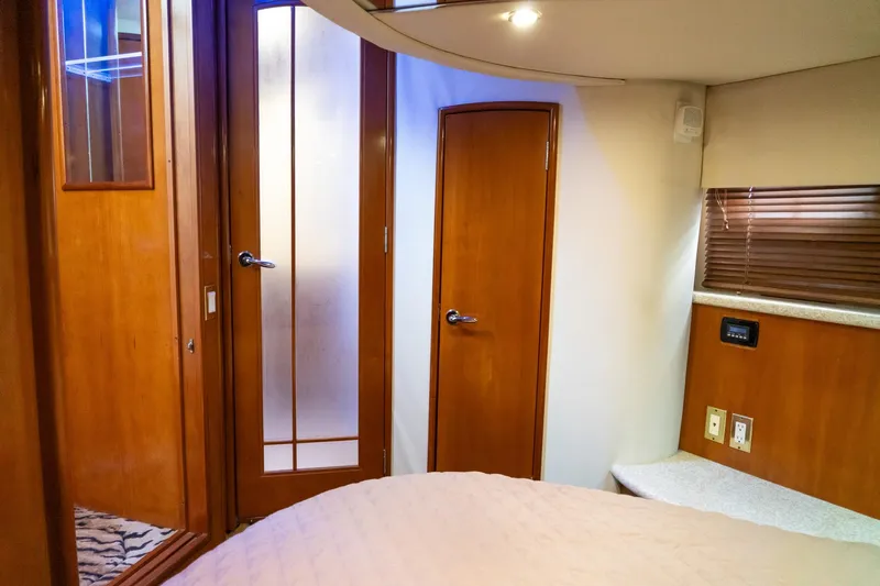 Slide: The Image of Interior of 2000 Carver 450 Voyager Pilothouse with wooden doors and cozy cabin design. - 67