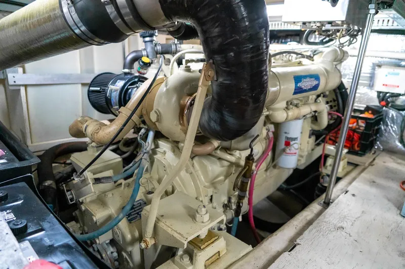 Slide: The Image of Engine room of a 2000 Carver 450 Voyager Pilothouse yacht, showcasing detailed machinery. - 71