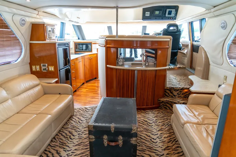 Slide: The Image of Luxurious interior of 2000 Carver 450 Voyager Pilothouse with leather seating and wood accents. - 31