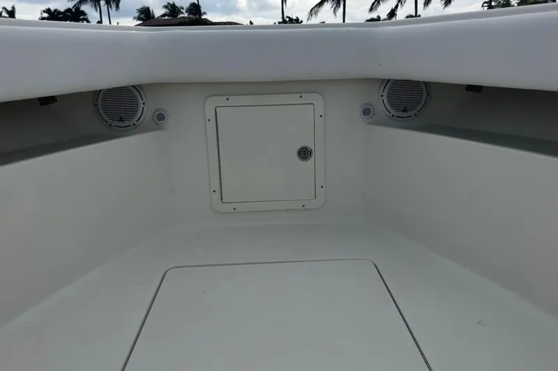 Slide: The Image of 2013 SeaVee 320B boat interior with storage compartment and speakers. - 15