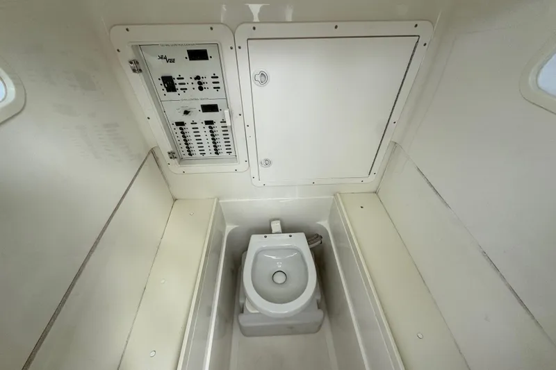 Slide: The Image of 2013 SeaVee 320B boat interior with control panel and marine toilet. - 17
