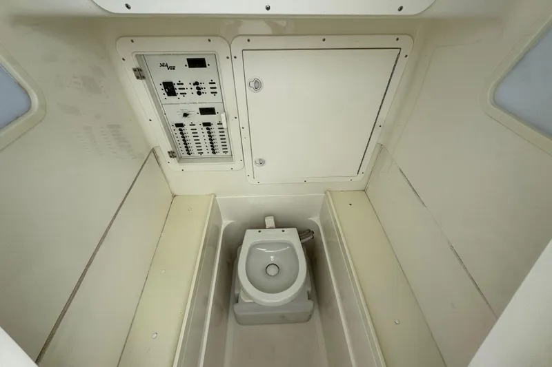 Slide: The Image of 2013 SeaVee 320B boat interior with toilet and control panel. - 18
