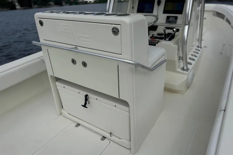 Slide: The Image of 2013 SeaVee 320B boat interior with helm station and storage compartments. - 19