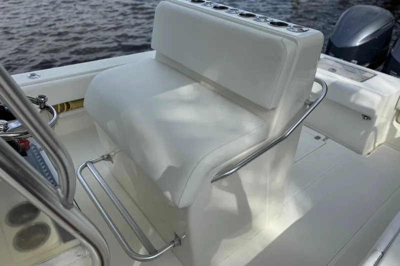 Slide: The Image of 2013 SeaVee 320B boat interior with white seating and stainless steel railings. - 20