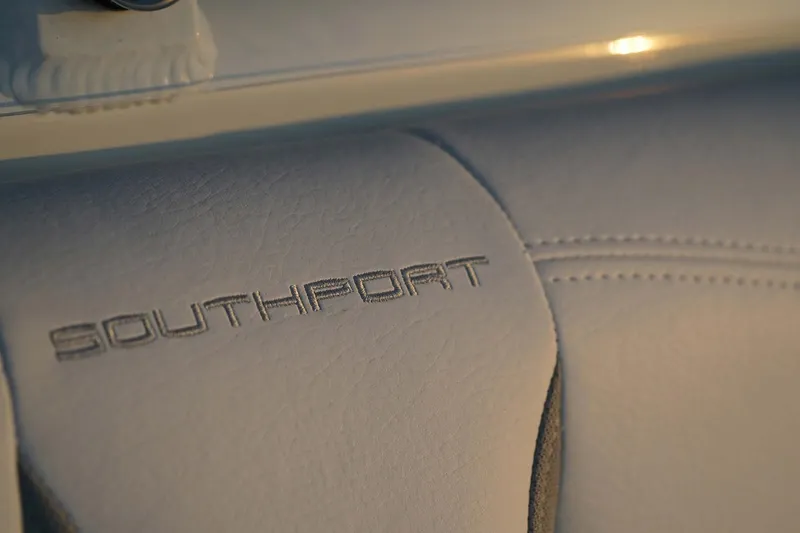 Slide: The Image of Manufacturer Provided Image: 2025 Southport 33 FE boat seat with embossed logo detail. - 10