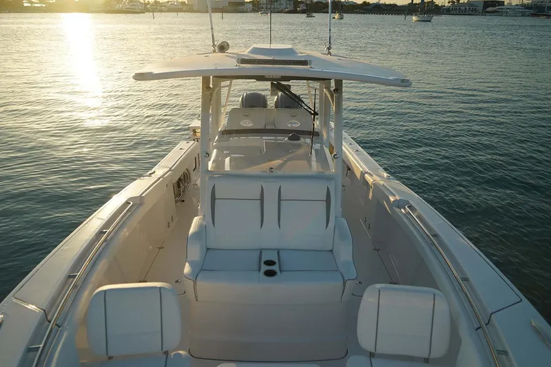 Slide: The Image of Manufacturer Provided Image: 2025 Southport 33 FE boat on calm water at sunset. - 3