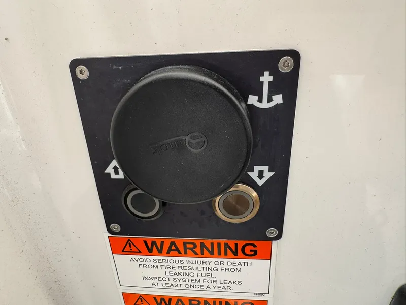 Slide: The Image of Warning label and control panel on 2024 Beneteau Oceanis 34.1 sailboat. - 23
