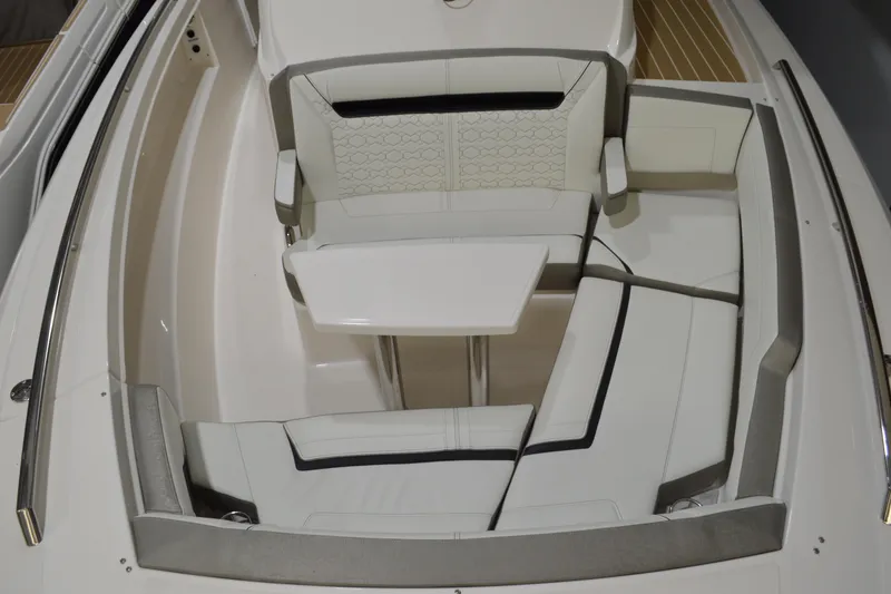 Slide: The Image of 2024 Tiara Yachts 34 LS boat interior with white seating and table. - 10