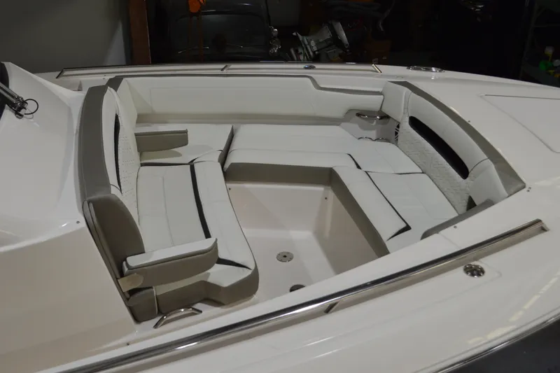 Slide: The Image of 2024 Tiara Yachts 34 LS interior seating area with white and gray upholstery. - 11