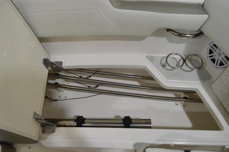 Slide: The Image of 2024 Tiara Yachts 34 LS interior storage with rod holders and cup holders. - 15