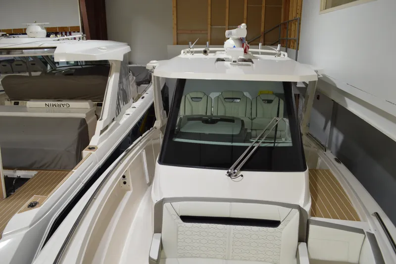 Slide: The Image of 2024 Tiara Yachts 34 LS luxury boat interior in showroom setting. - 19