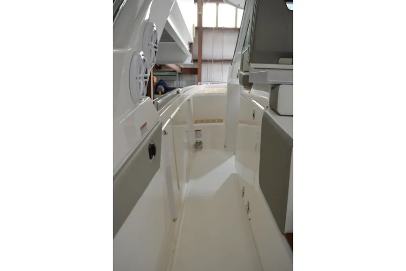 Slide: The Image of 2024 Tiara Yachts 34 LS interior walkway with modern design and seating. - 23