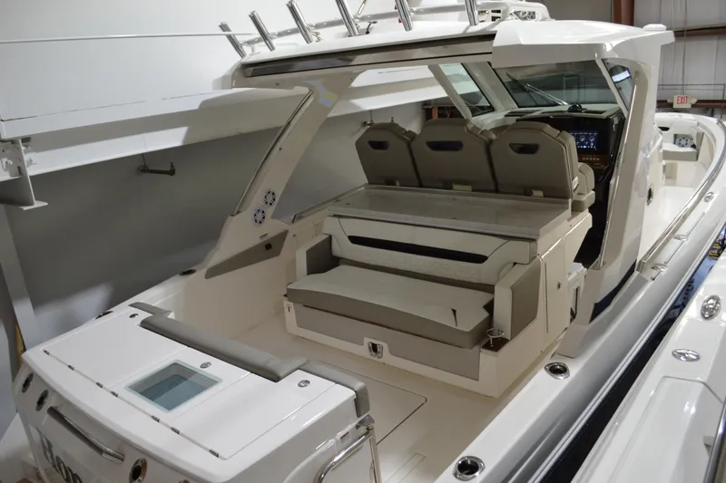 Slide: The Image of 2024 Tiara Yachts 34 LS interior with seating and helm, showcasing luxury design. - 27
