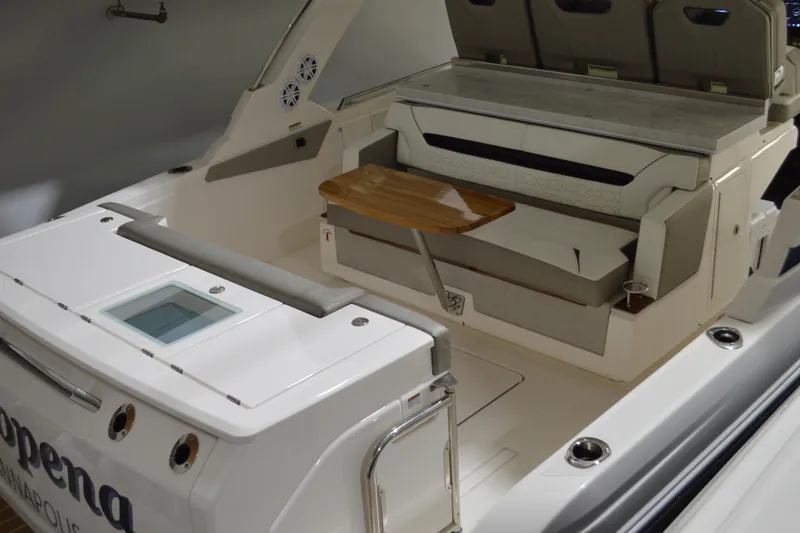 Slide: The Image of 2024 Tiara Yachts 34 LS interior with seating and wooden table. - 28