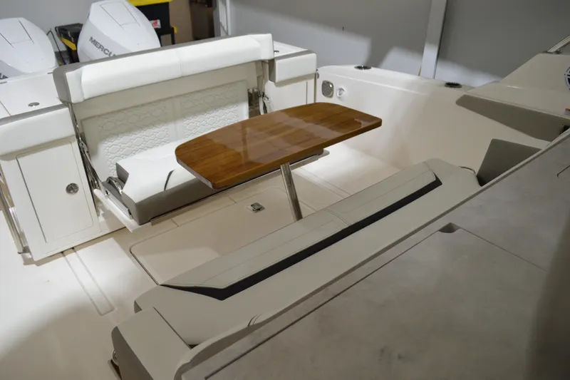 Slide: The Image of 2024 Tiara Yachts 34 LS interior with seating and wooden table. - 29