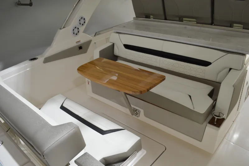 Slide: The Image of 2024 Tiara Yachts 34 LS interior with elegant seating and wooden table. - 31