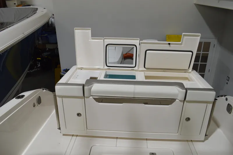 Slide: The Image of 2024 Tiara Yachts 34 LS boat interior with storage compartments and seating. - 38