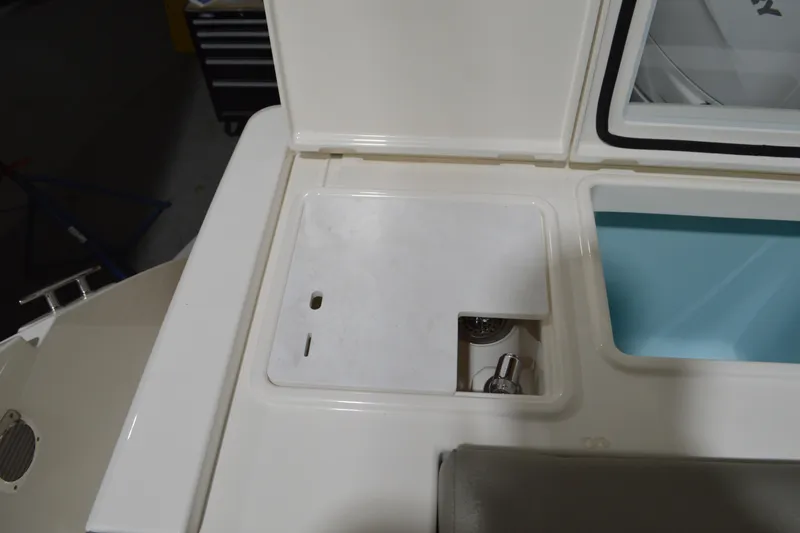 Slide: The Image of 2024 Tiara Yachts 34 LS boat interior detail with storage compartment and sink. - 42