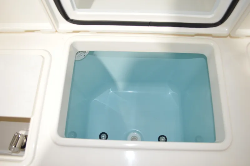 Slide: The Image of 2024 Tiara Yachts 34 LS livewell with open lid, showcasing interior design. - 43