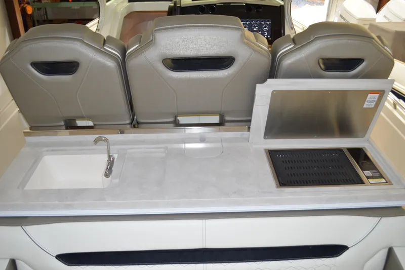 Slide: The Image of 2024 Tiara Yachts 34 LS interior with sink and grill station. - 48