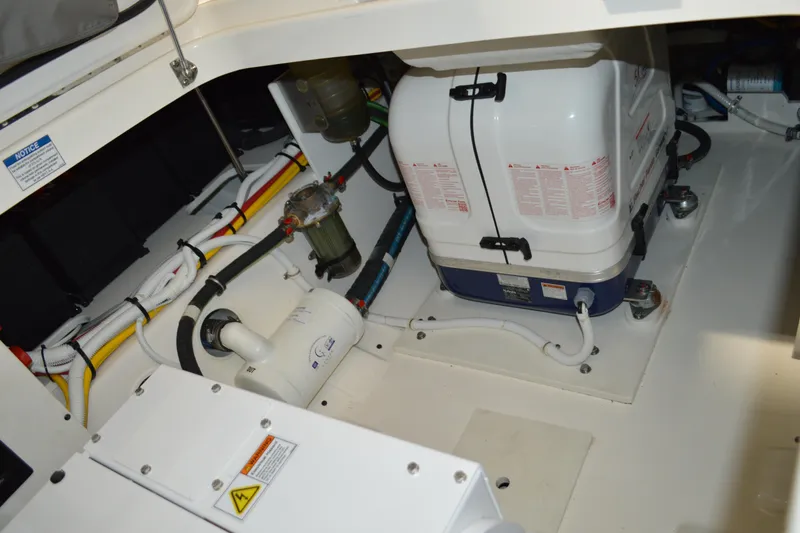 Slide: The Image of Engine compartment of 2024 Tiara Yachts 34 LS, showcasing mechanical components and wiring. - 51