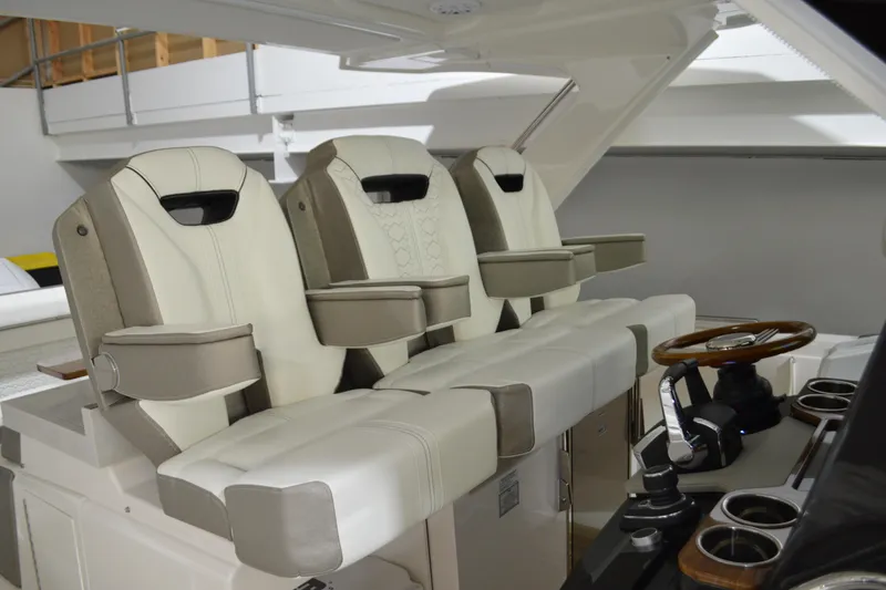Slide: The Image of 2024 Tiara Yachts 34 LS interior with luxurious seating and modern helm design. - 54