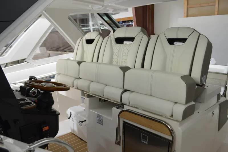 Slide: The Image of 2024 Tiara Yachts 34 LS interior with luxurious seating and modern helm design. - 55