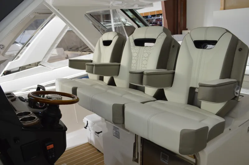 Slide: The Image of 2024 Tiara Yachts 34 LS interior with luxurious seating and modern helm design. - 56