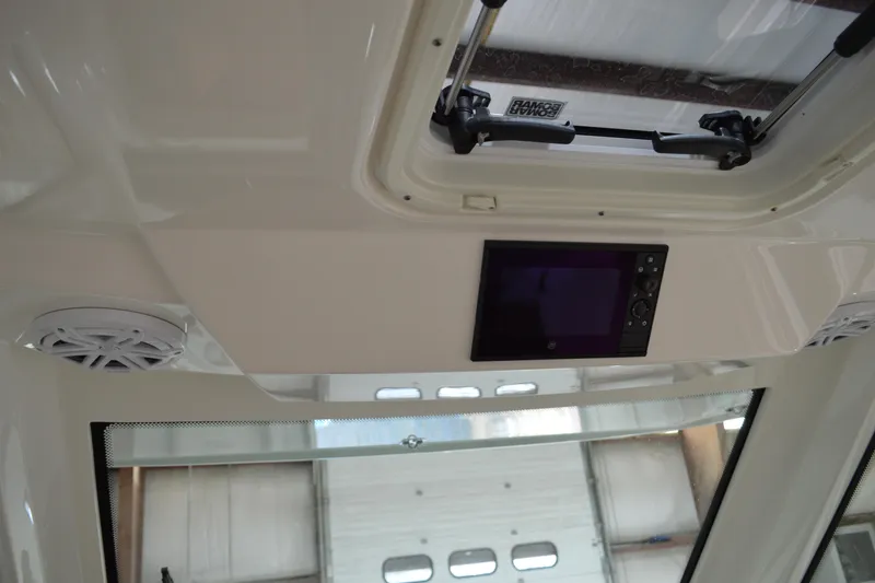 Slide: The Image of 2024 Tiara Yachts 34 LS interior ceiling with speakers and control panel. - 58