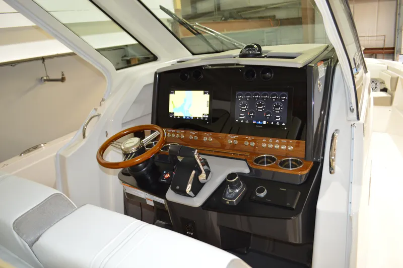 Slide: The Image of 2024 Tiara Yachts 34 LS helm with modern navigation and control systems. - 62