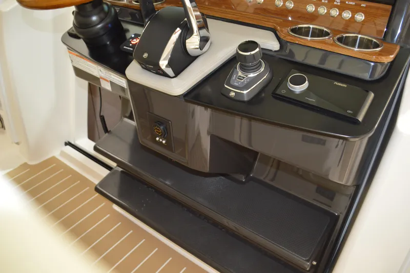 Slide: The Image of 2024 Tiara Yachts 34 LS helm with modern controls and sleek design. - 65